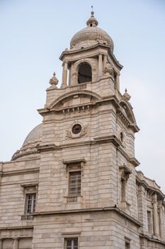 Close-up shot of Victoria Memorial tower showcasing intricate architectural design in Kolkata, India.
