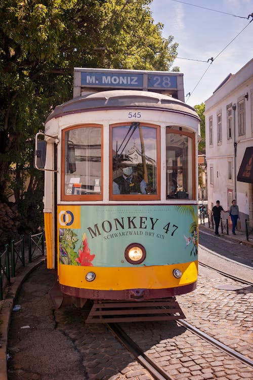 Historic Lisbon Tram 28 with an Advertisement