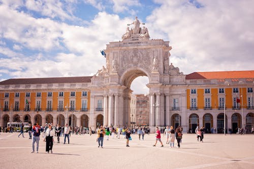 Crowd on Commerce Plaza in front of Rua Augusta Arch in Lisbon