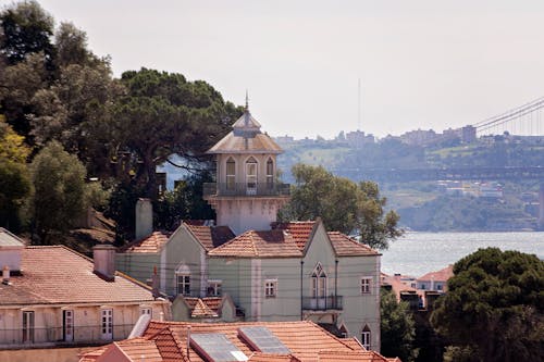 Buildings and Trees on Sea Coast in Lisbon