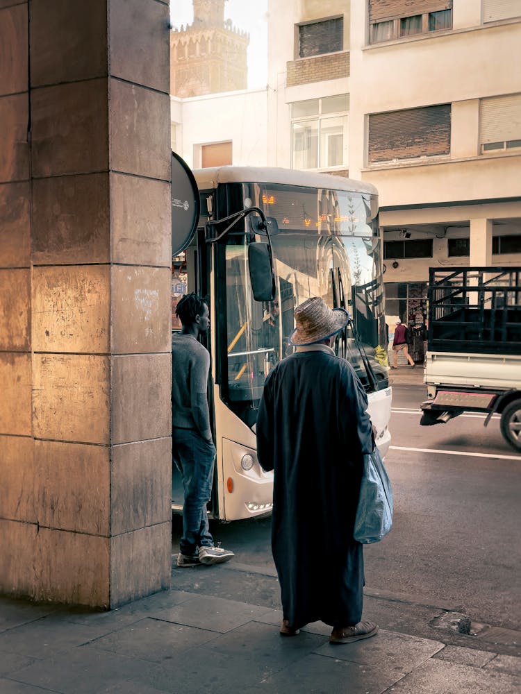 People Waiting For The Bus