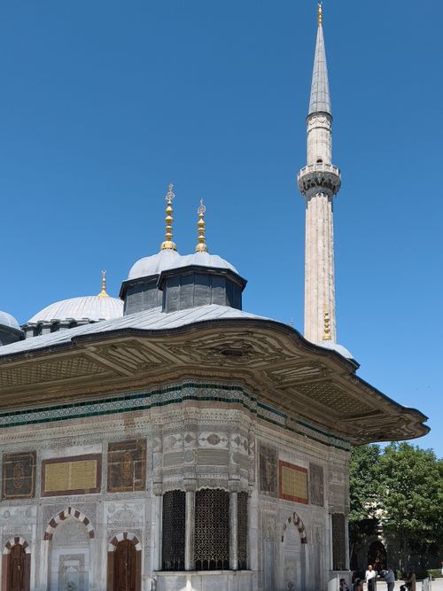 Free The ornate Sultan Ahmed III Fountain and Minaret in Istanbul under a clear sky. Stock Photo