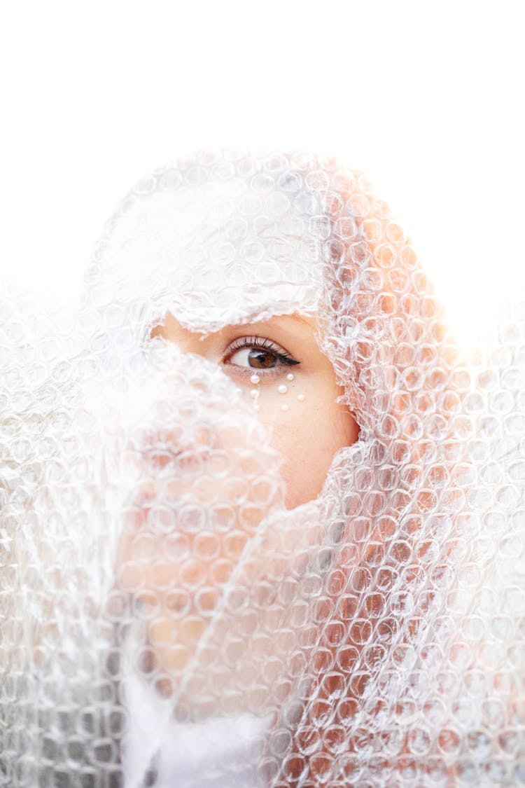 Woman Face Behind Bubble Wrap