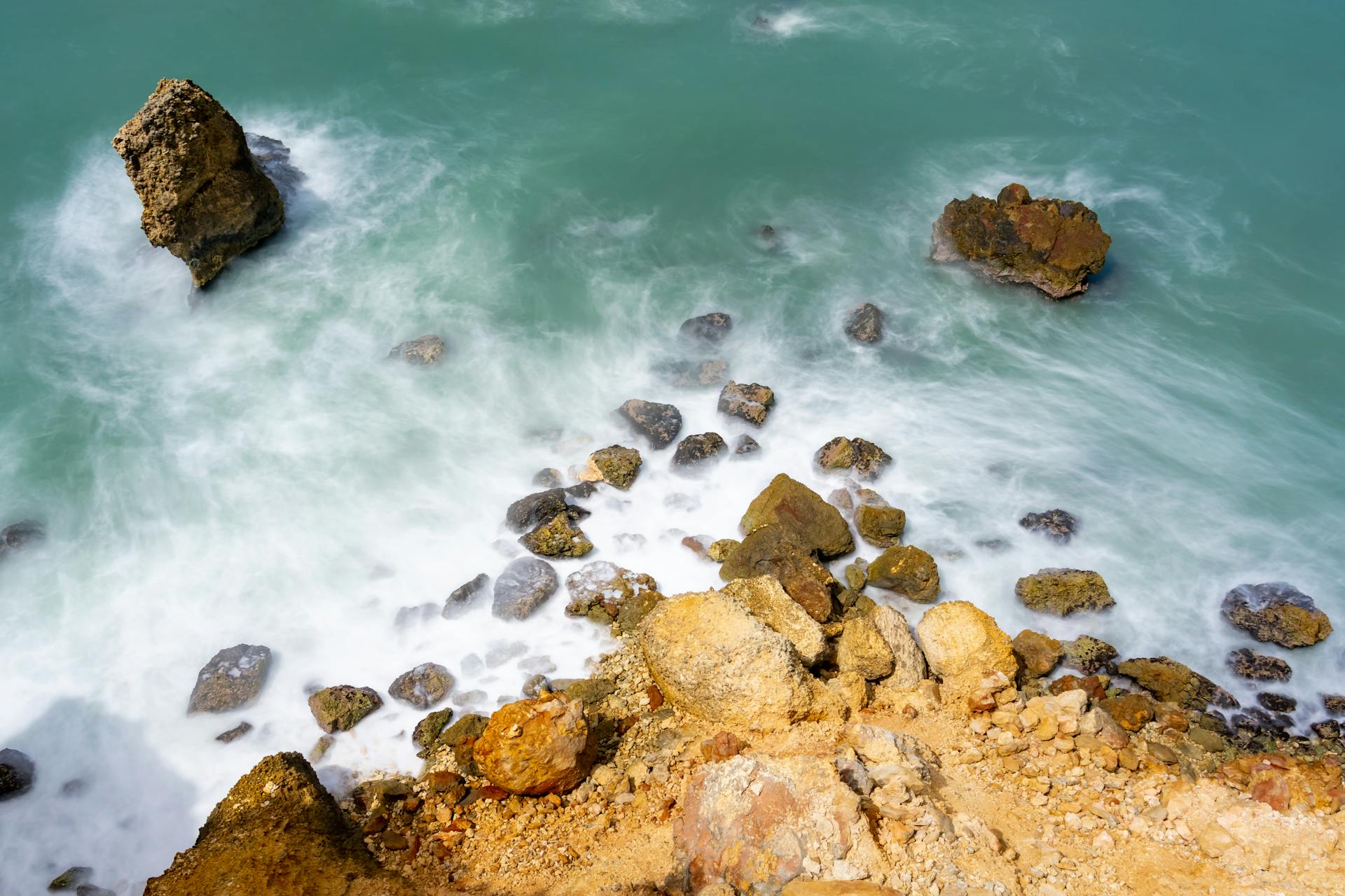 Explore the eroded cliffs and serene turquoise waters of Cabo Rojo, Puerto Rico from above.