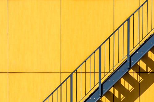 Stairs on Yellow Wall