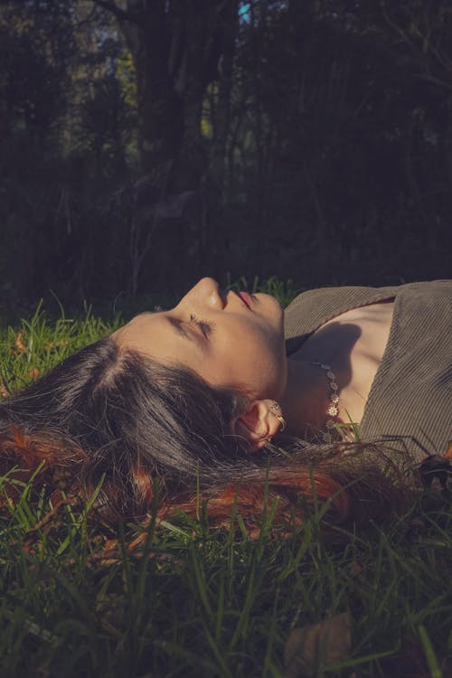 Woman Lying Down on Grass