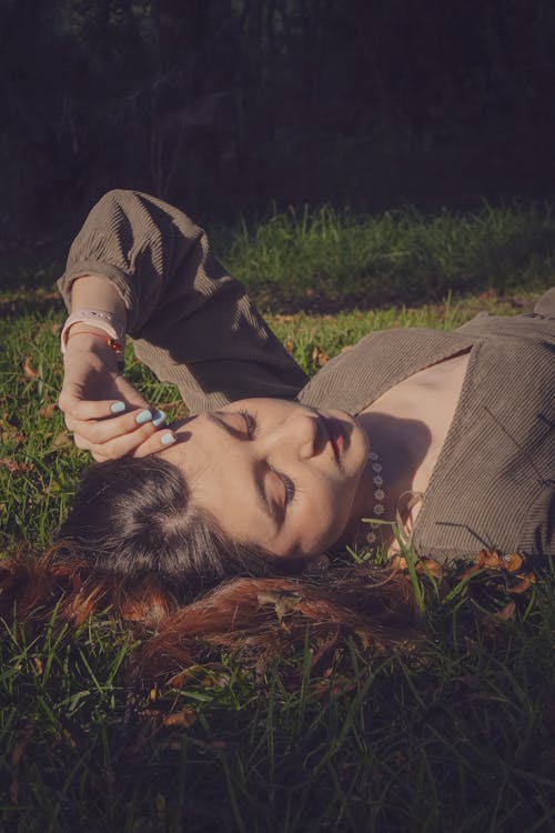 Woman Lying Down on Grass