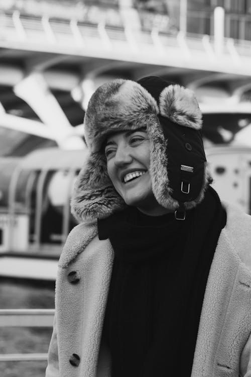 Smiling Woman in Woolen Coat and Fur Hat