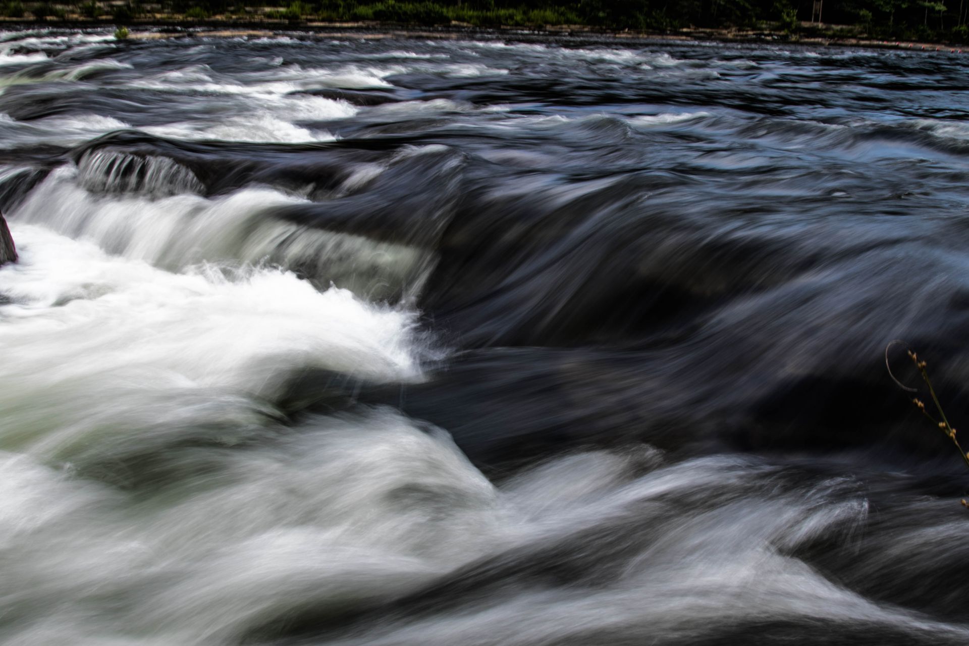 A stunning view of fast-flowing river rapids showcasing the power of nature.