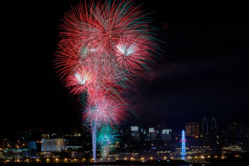 Free Vivid fireworks illuminate Baku cityscape at night, creating a colorful and festive atmosphere. Stock Photo