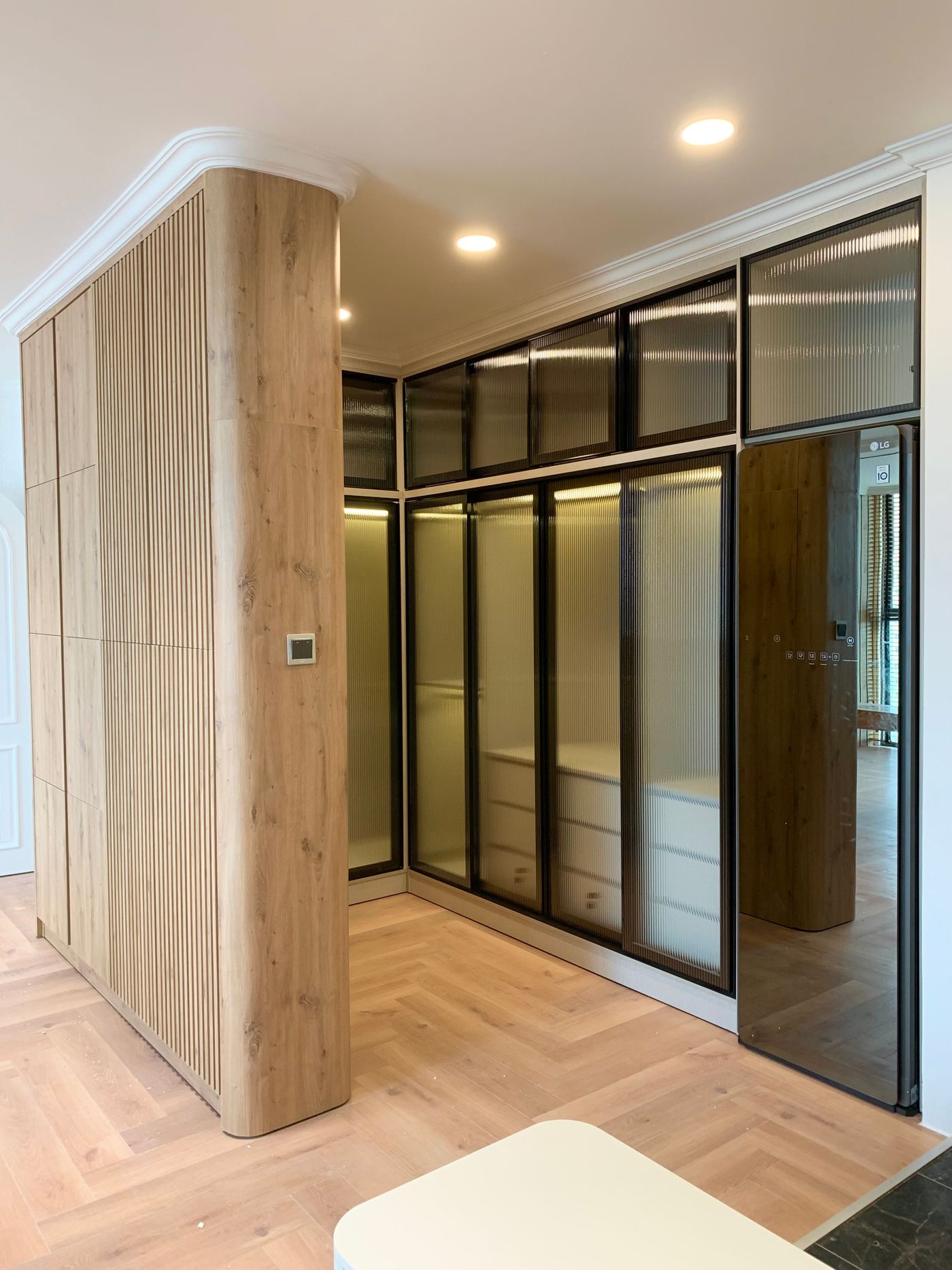 Modern interior with wooden wall panels and integrated lighting
