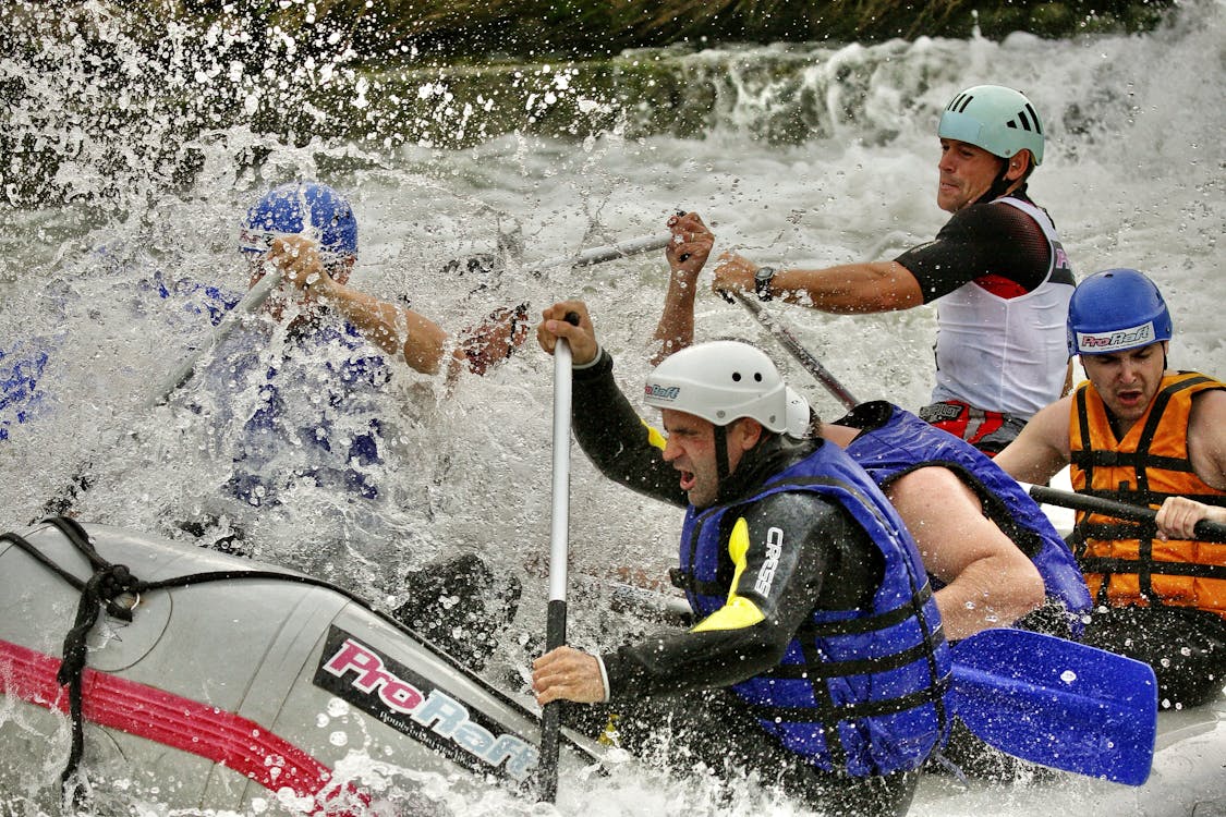 Free A group of people in white water rafting Stock Photo