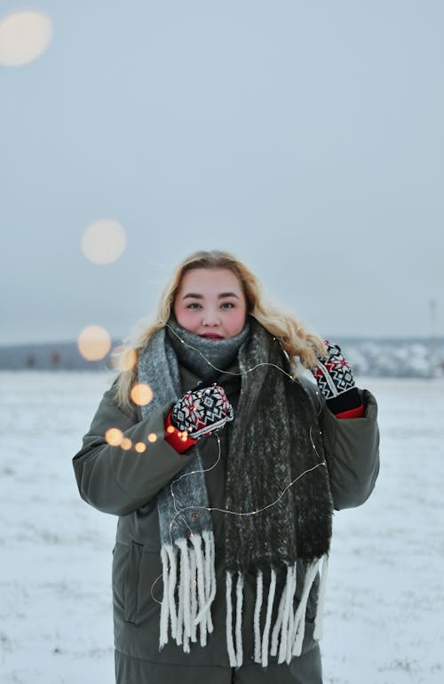 Blonde Model Standing in Scarf and Jacket