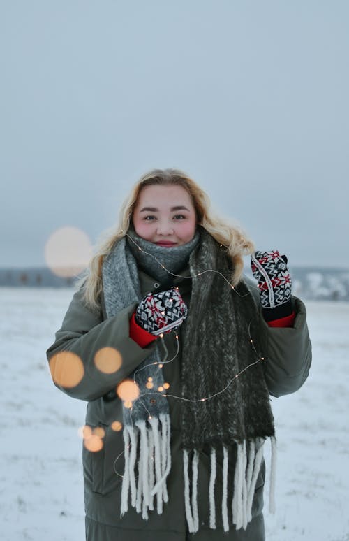 Smiling Blonde Woman in Jacket and Scarf