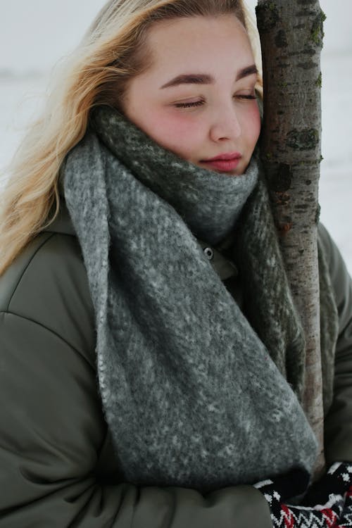 Blonde Woman in Scarf and with Eyes Closed