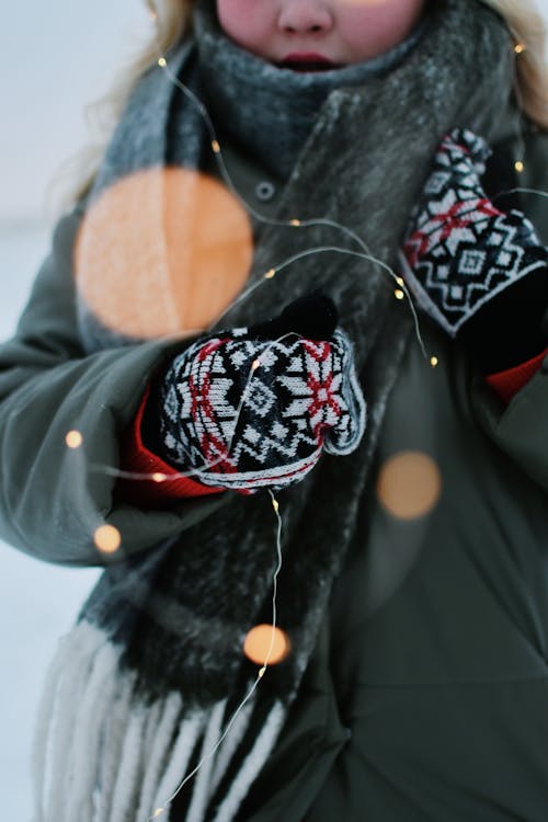 Woman Wearing Coat and Gloves on Winter Day