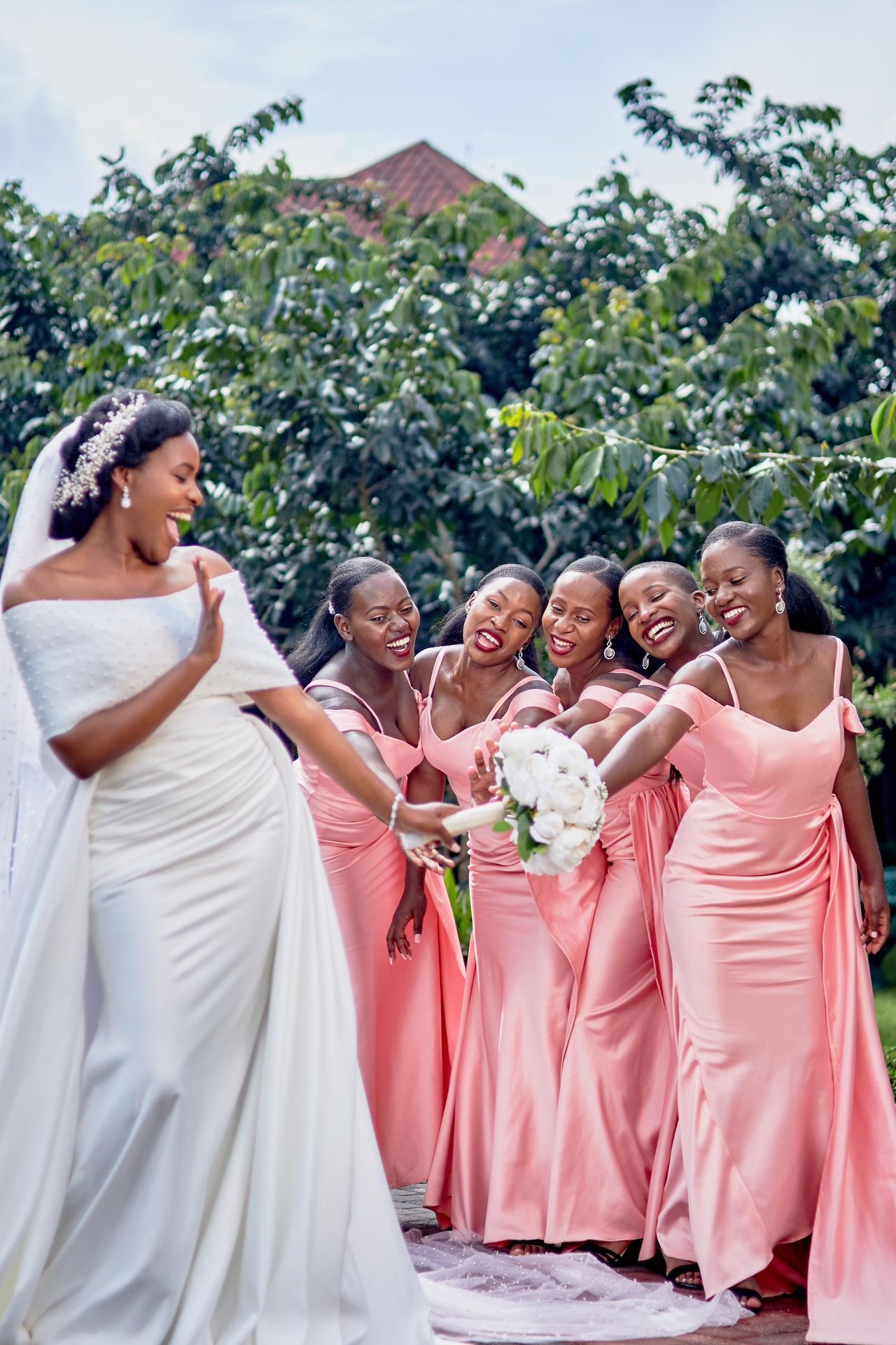 Bride and bridesmaids at wedding ceremony with bouquets