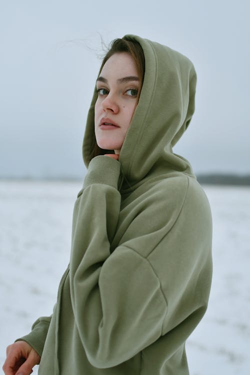 Young Brunette Woman in Green Hoodie