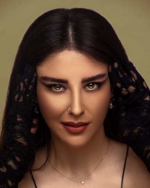 Studio Portrait of a Young Brunette in a Glamour Makeup Look 