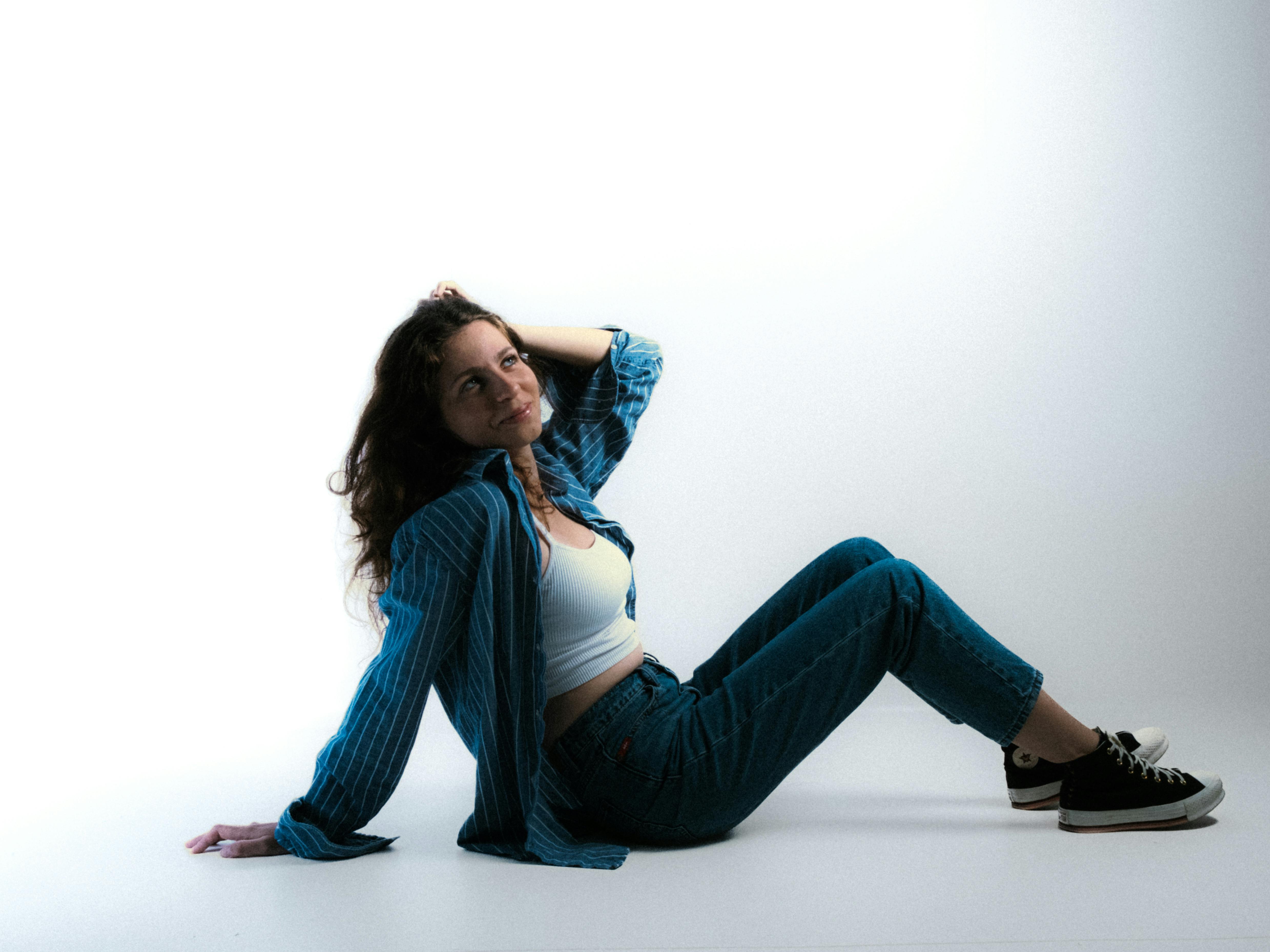 Woman Sitting on Floor in Studio · Free Stock Photo