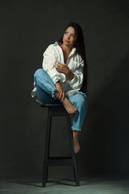 Brunette Young Woman in White Shirt and Jeans