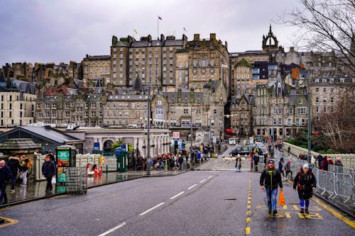 People Walking on Waverley Bridge on a Rainy Day, Edinburgh, Scotland, UK