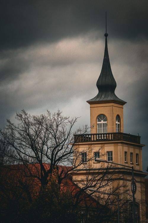 Free A dramatic view of a historic tower in Bautzen with an overcast sky, highlighting urban architecture. Stock Photo