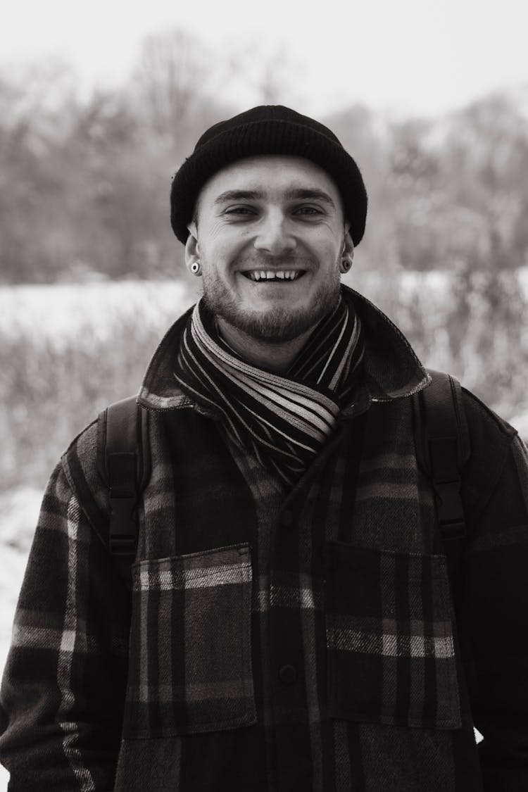 Smiling Man In Scarf And Hat