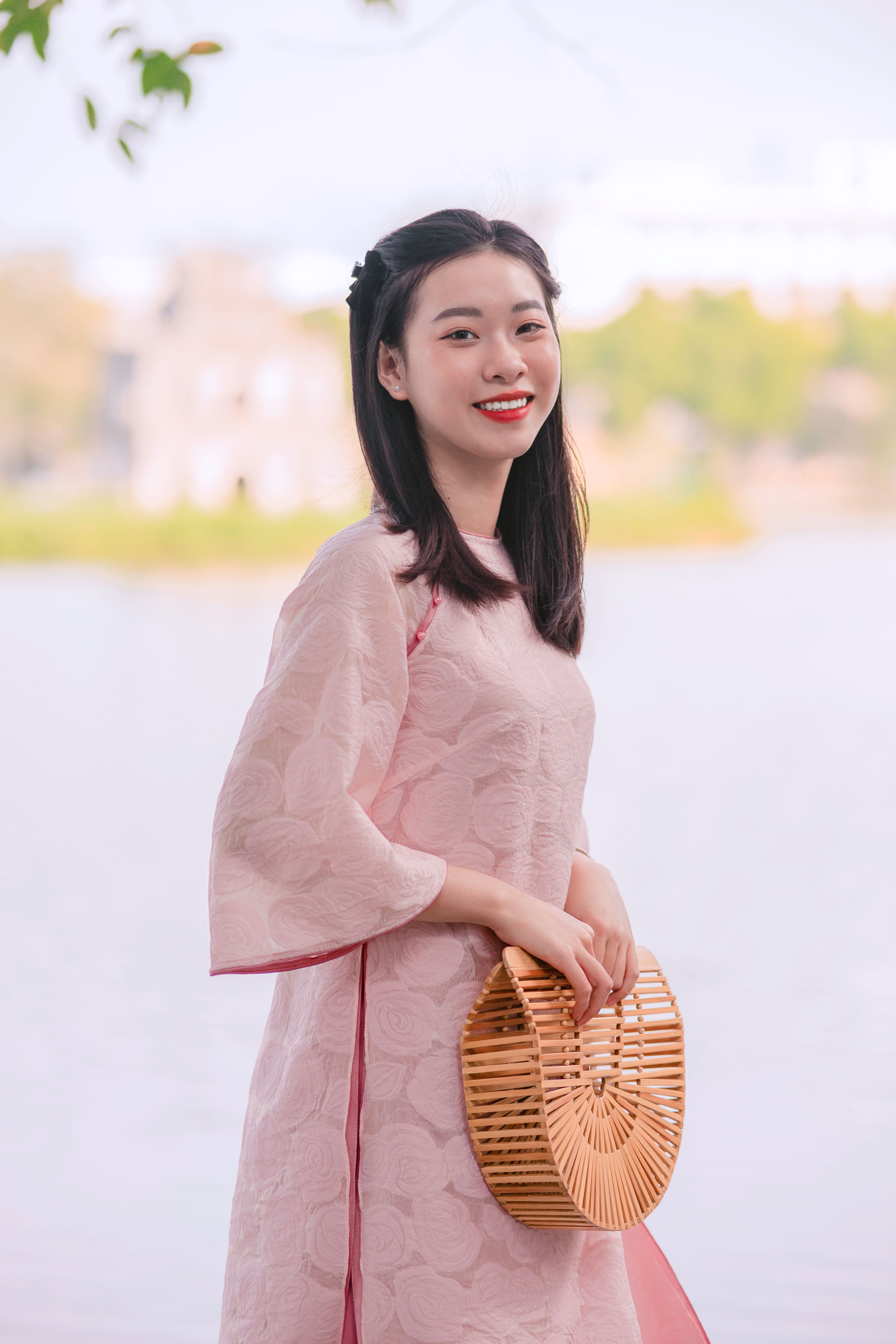 Smiling Woman with Bag and in Traditional Clothing · Free Stock Photo