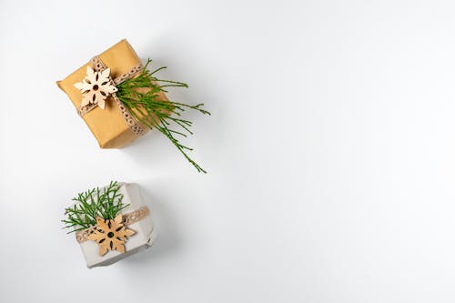 Wrapped Present Boxes Decorated with Green Samphire Twigs