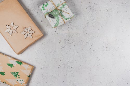 Presents Wrapped in Paper Lying on Gray Background