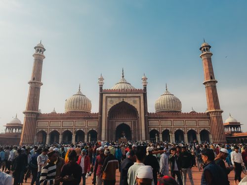 Free Jama Masjid in Delhi during a busy day with a diverse crowd in front. Stock Photo