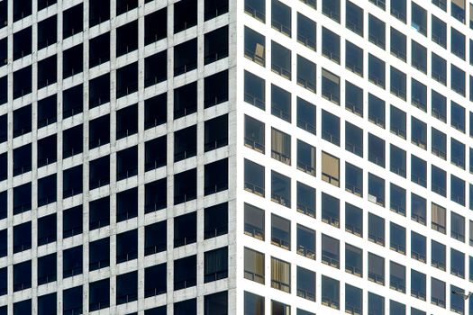 Close-up of a modern office building facade in Rotterdam with geometric patterns.