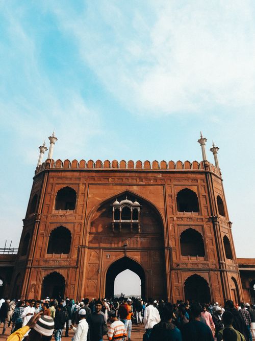 Free A vibrant scene of a crowd gathering at the iconic Jama Masjid in Old Delhi, India. Stock Photo