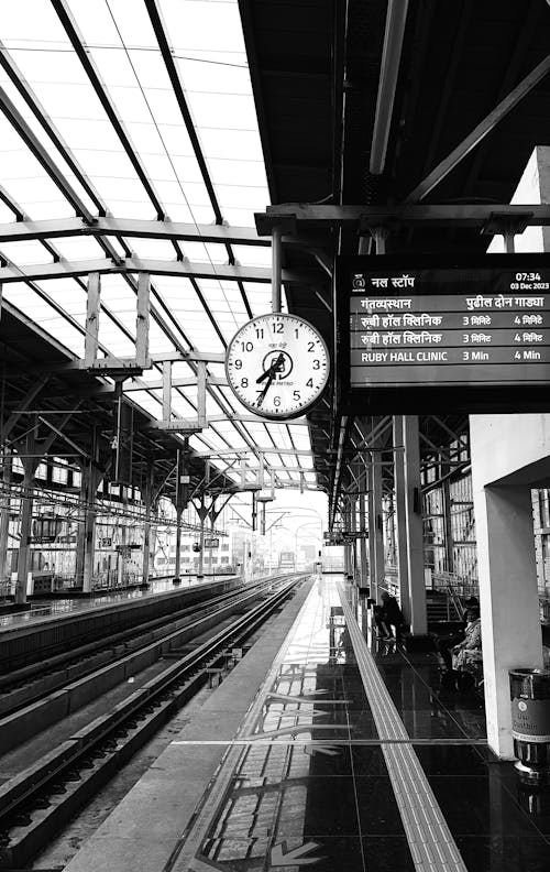 Free Black and White Photo of a Railway Station Platform  Stock Photo