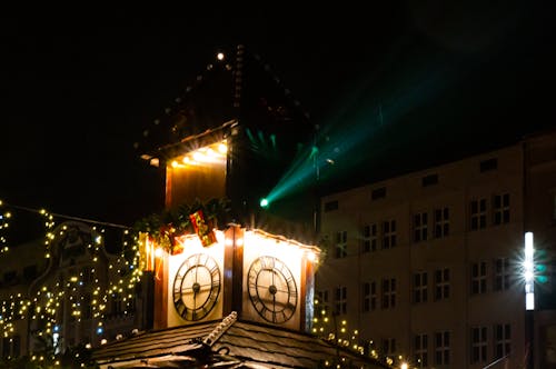Wooden Elegance: Clock Tower Glow in the Night Market