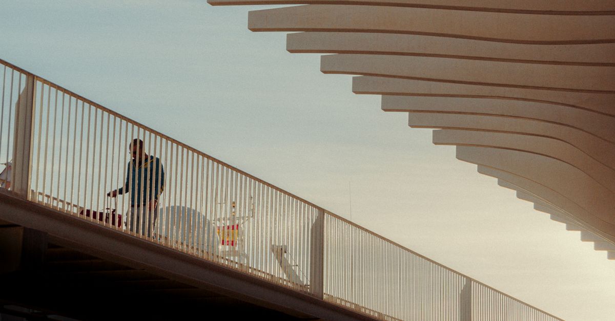 Bridge Railing Shot Man Walking behind Bridge Railing · Free Stock Photo