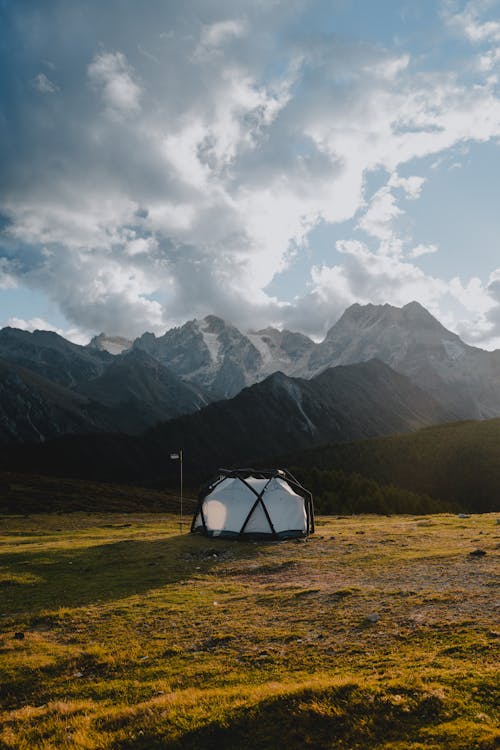 Tent on a Field in a Mountain Valley 