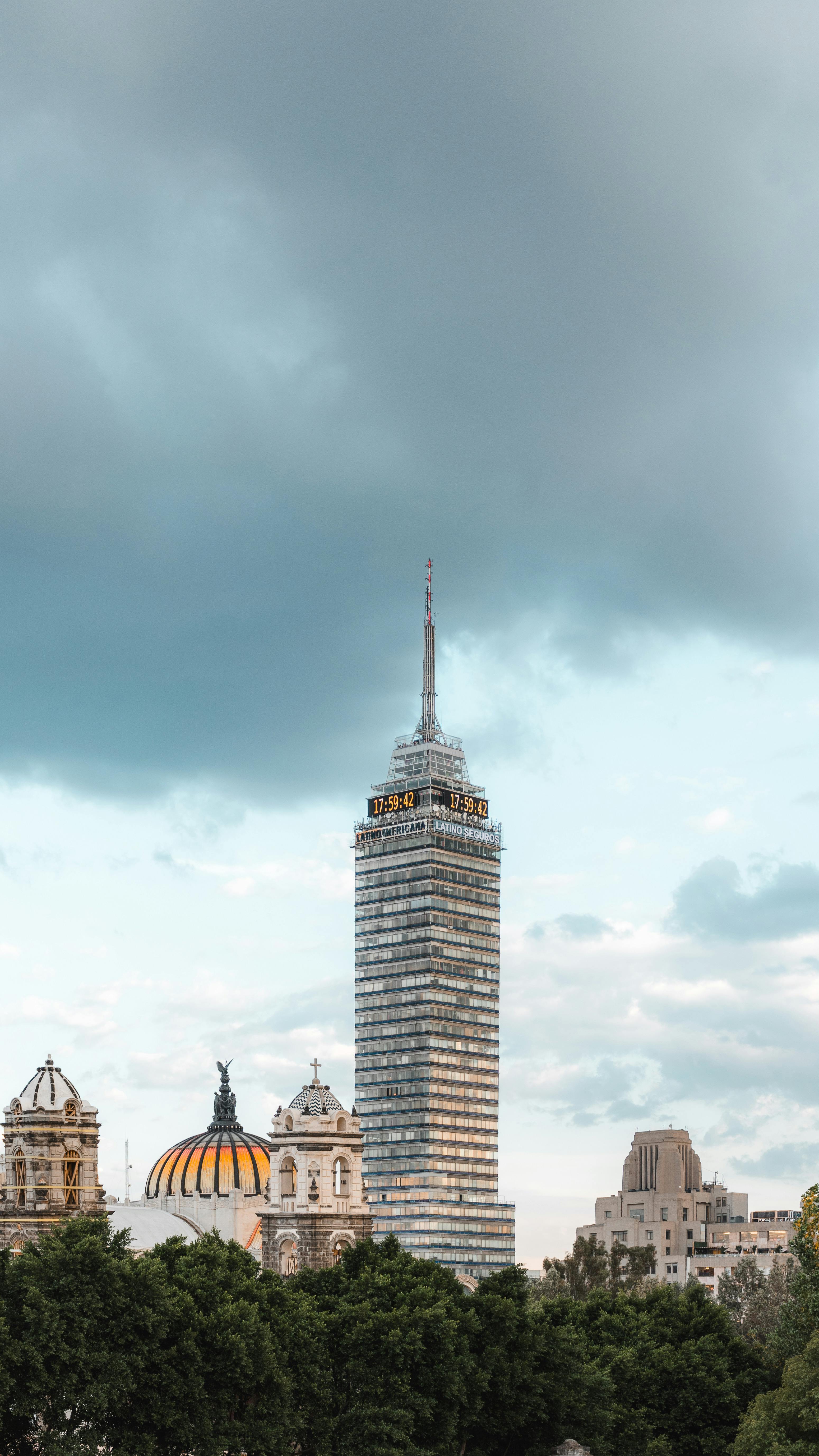The Torre Latinoamericana towers over Cuauhtémoc, CDMX with dramatic skies.