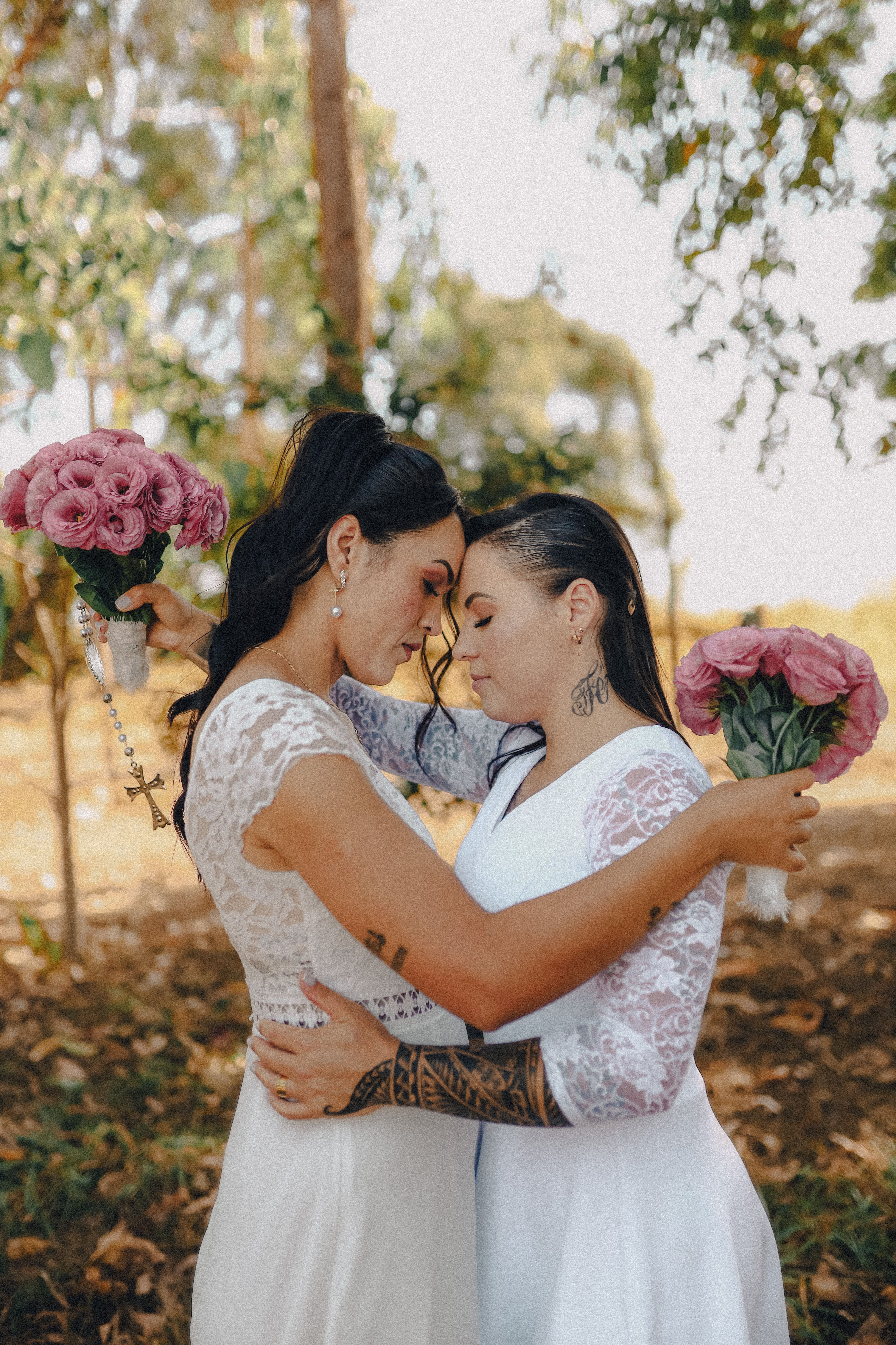 Brides in Wedding Dresses Embracing  Free Stock Photo