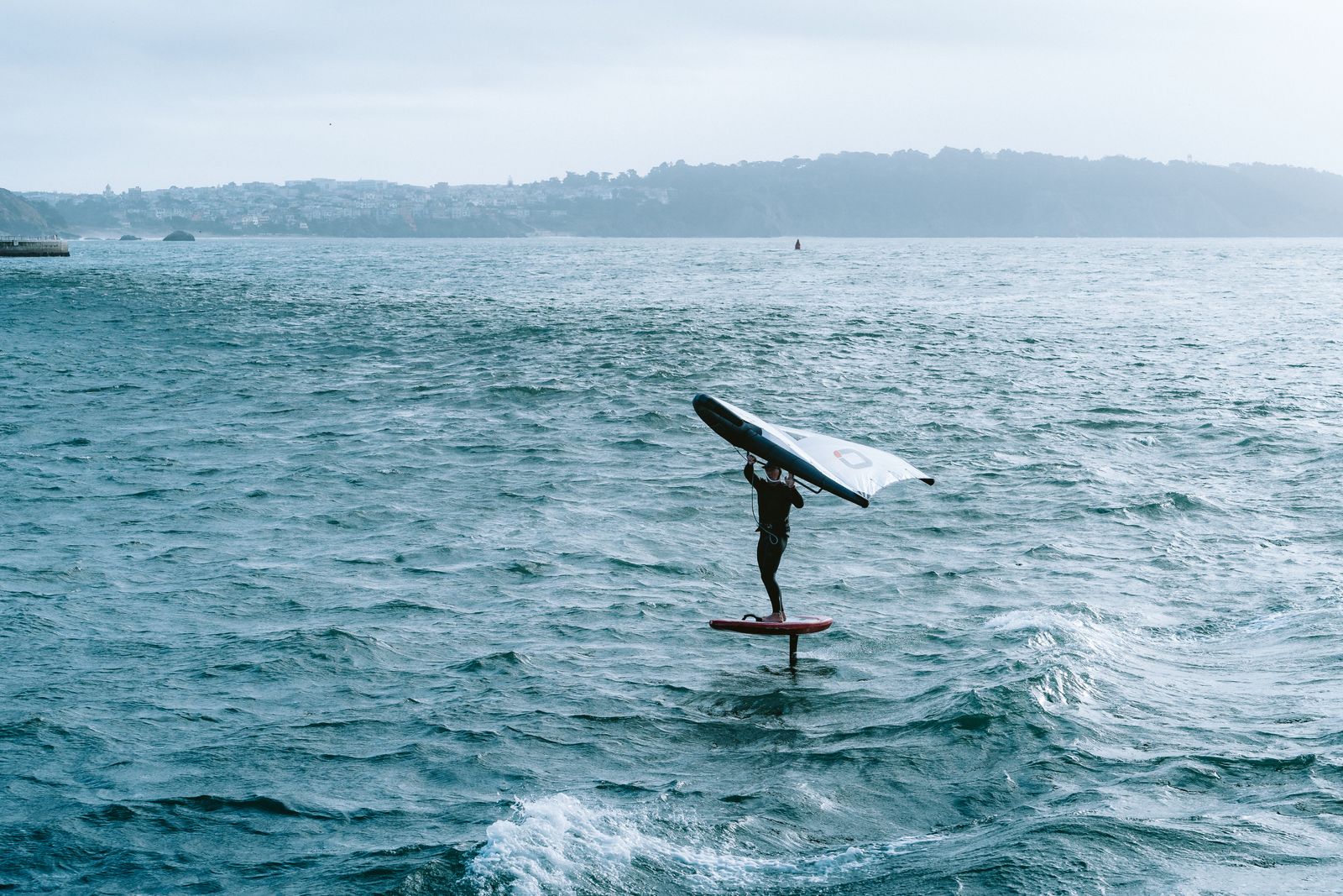 Foiler riding across open water on San Francisco Bay [PLACEHOLDER: replace photo — shows a wingfoiler]