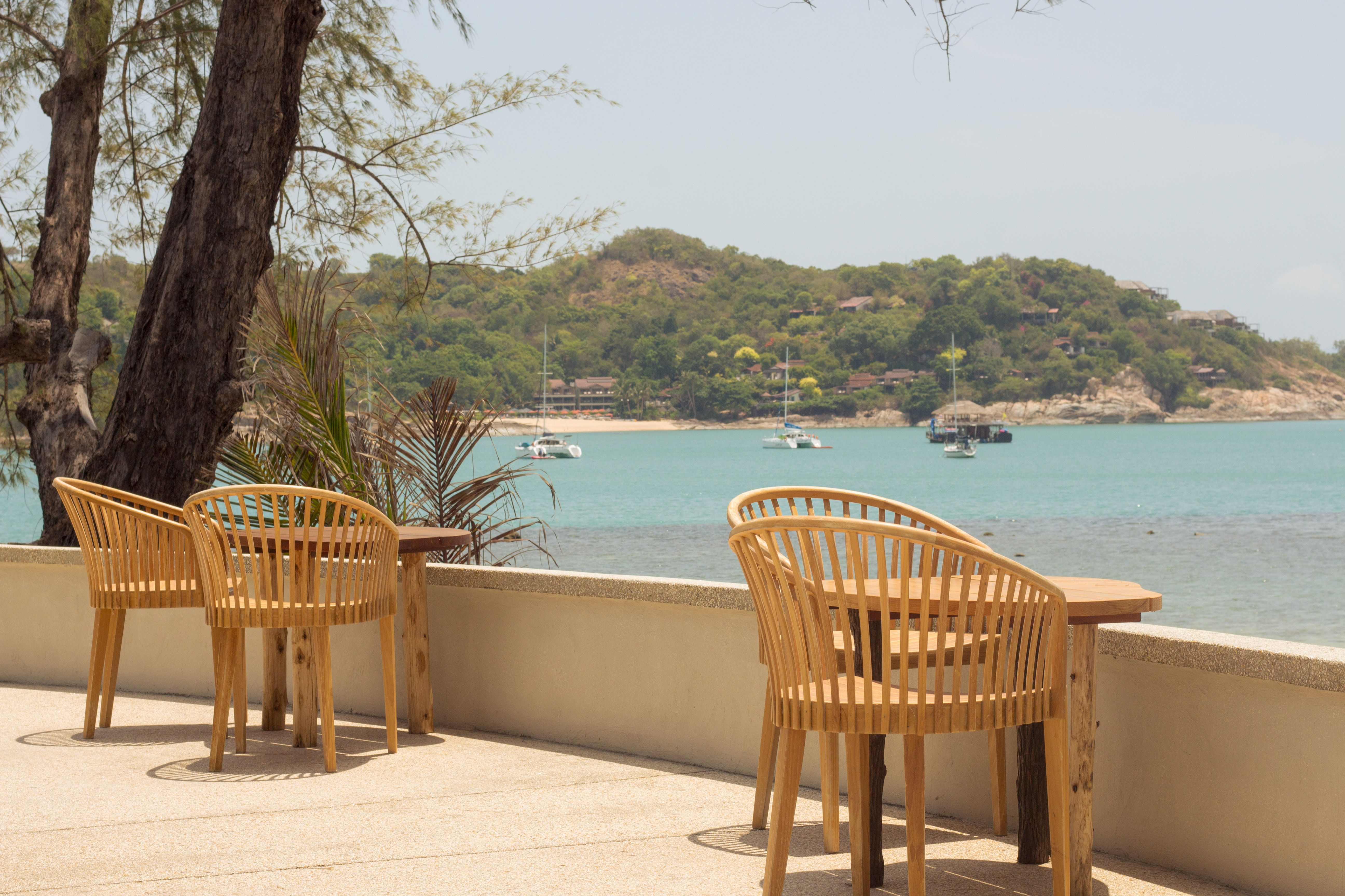 Wooden Chairs on a Terrace by the Sea · Free Stock Photo