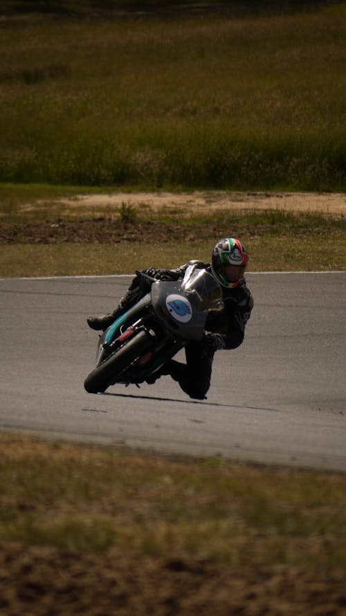 Person Riding Super Bike during Night Race · Free Stock Photo