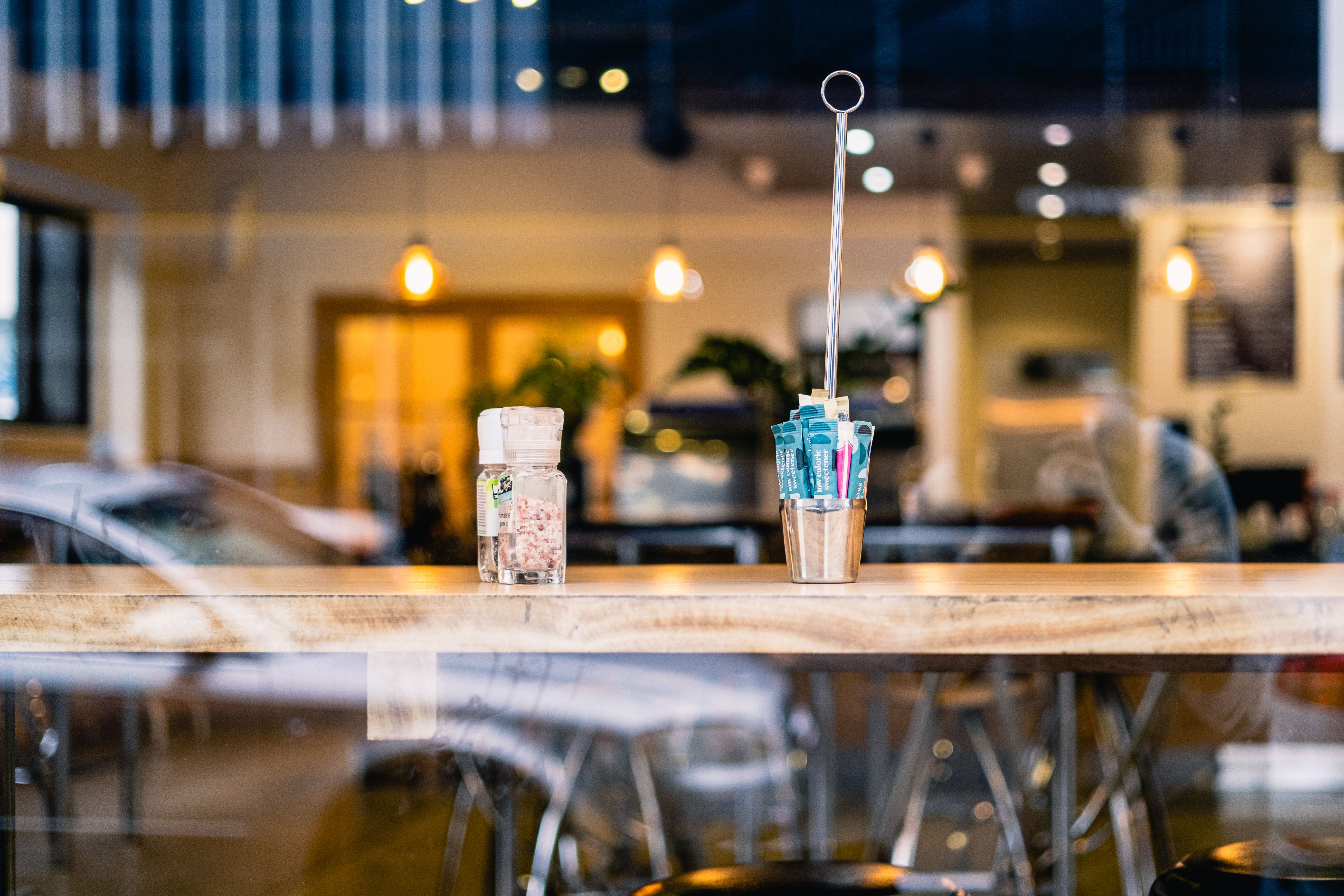 Cafe Table, Street Reflection in Window · Free Stock Photo