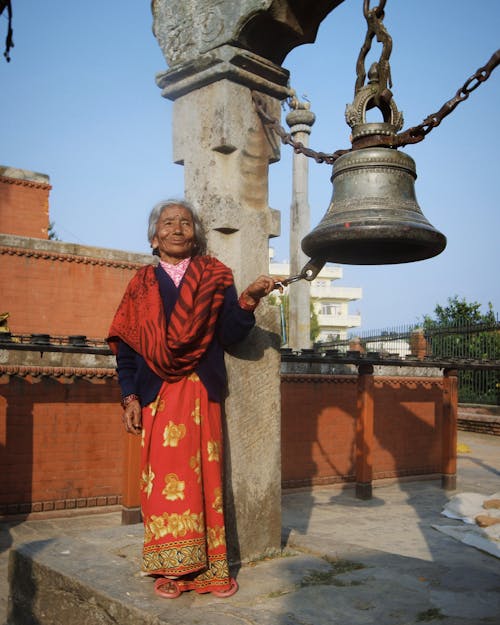 Woman with Monastery Bell