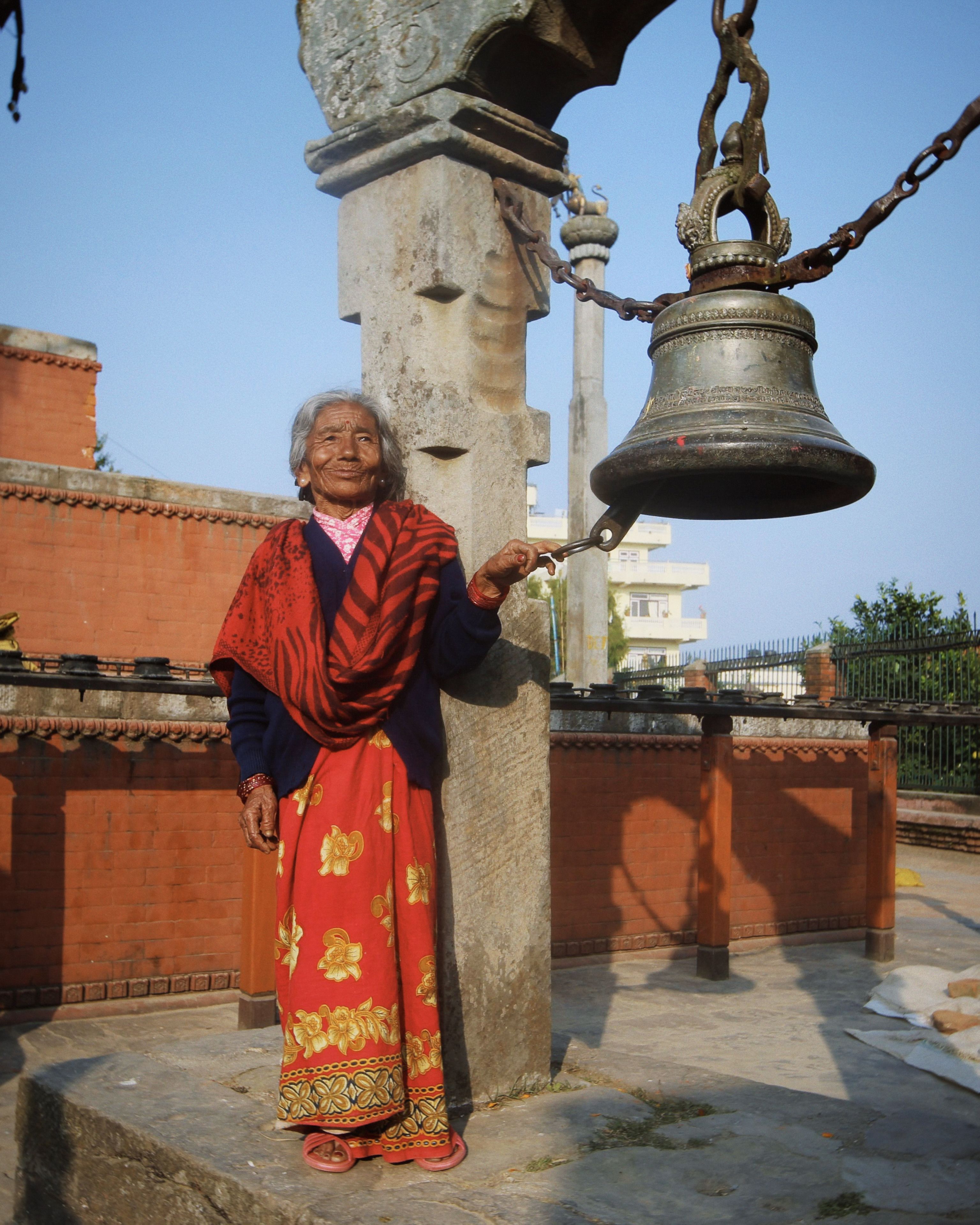 Woman with Monastery Bell · Free Stock Photo
