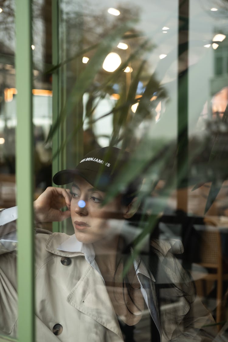 Woman In A Restaurant Seen By The Window 