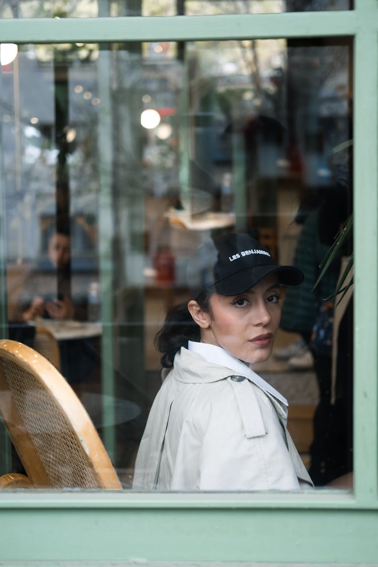 Woman In A Restaurant Seen By The Window 