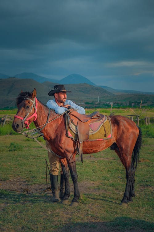 Cowboy Standing with Horse