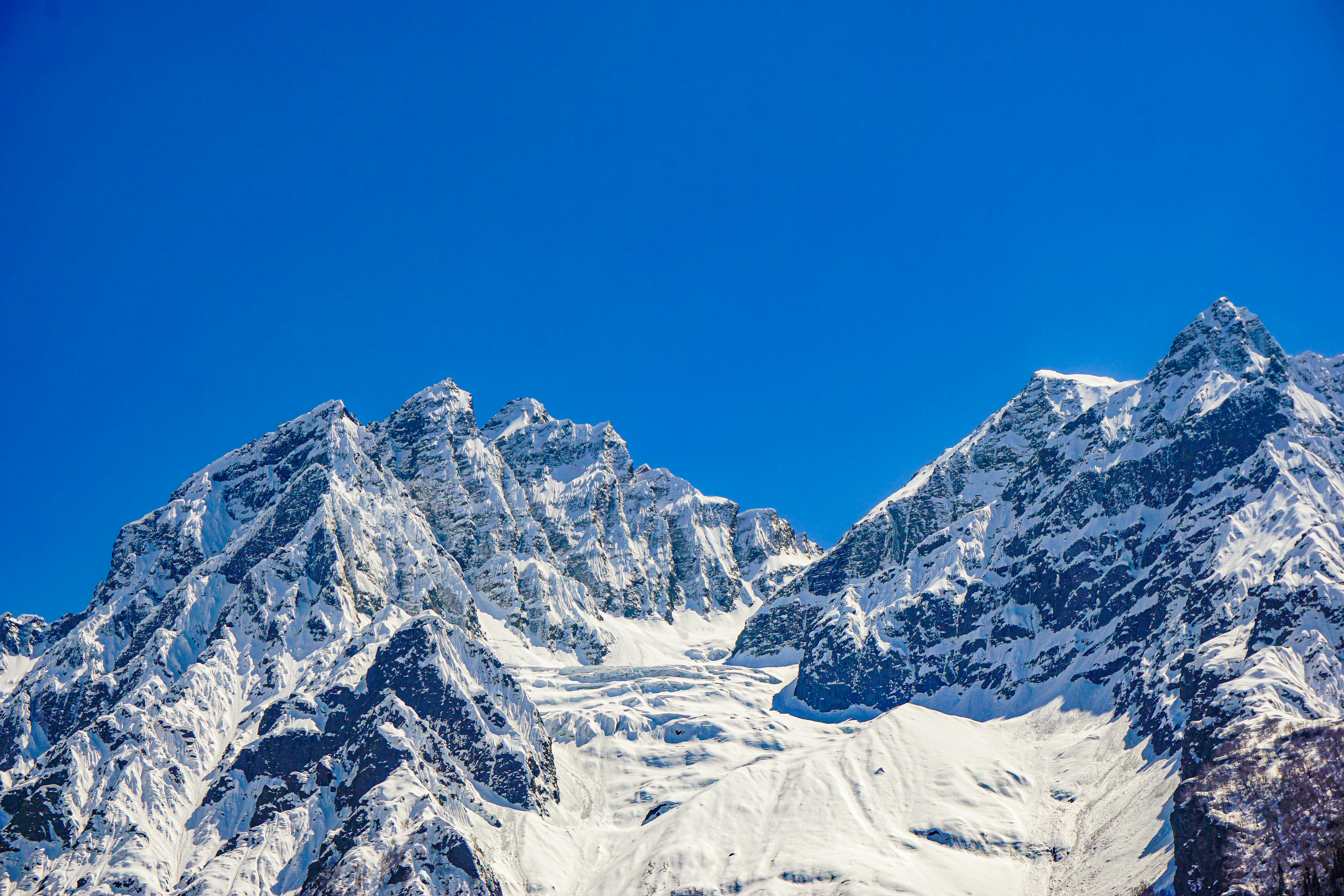 Free Stunning view of the snow-covered mountains in Sonamarg under a clear blue sky. Stock Photo